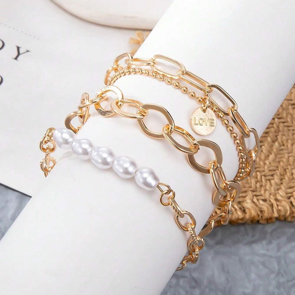 Dreiteiliges Set mit goldenen Perlenarmbändern - umfangreiches Kettenset