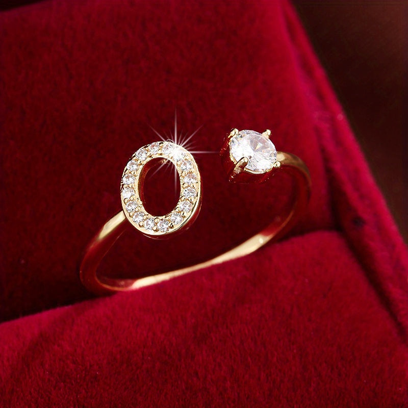 Nova – Moderner offener Ring mit Buchstaben und Zirkonia