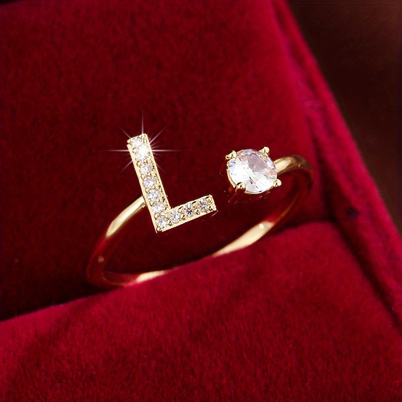 Nova – Moderner offener Ring mit Buchstaben und Zirkonia