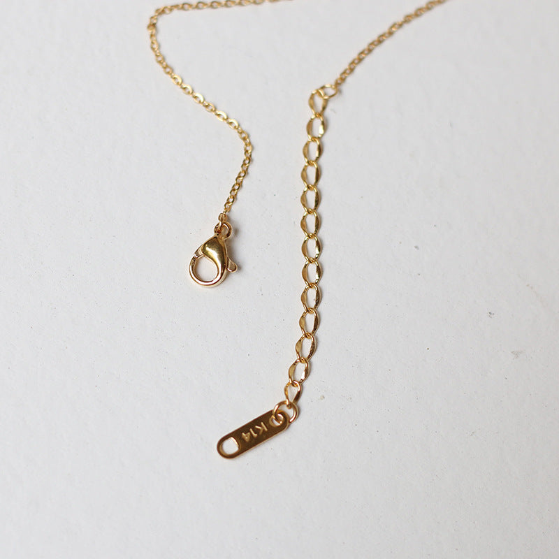 Nelly – Minimalistisches Kreuzhalsband in Gold