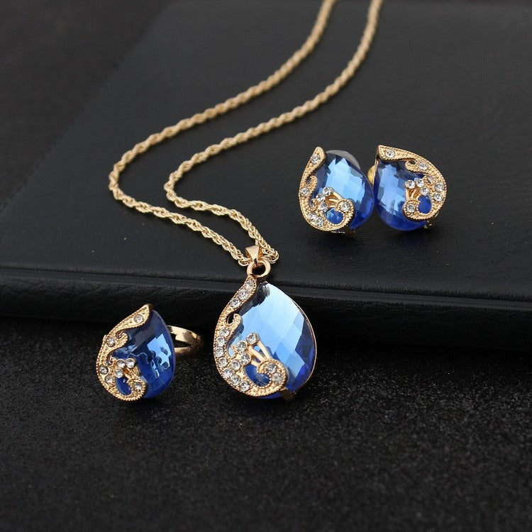 Pia – Schmuckset mit Halskette und Ohrringen aus blauen und goldenen Kristallen