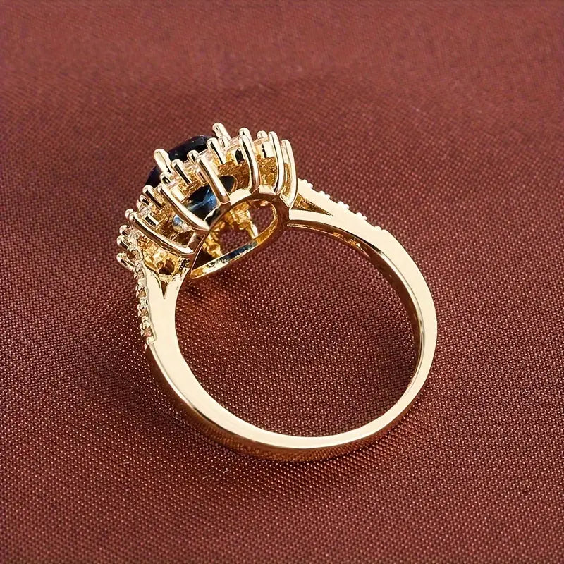 Delphine – Stilvoller goldener Ring mit blauer Stein