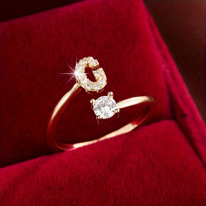 Nova – Moderner offener Ring mit Buchstaben und Zirkonia