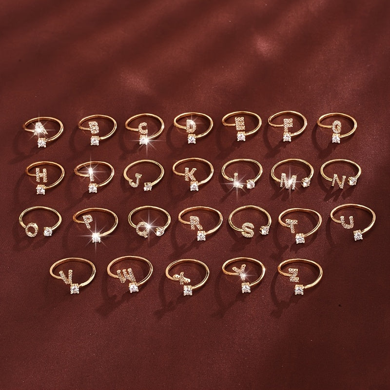 Nova – Moderner offener Ring mit Buchstaben und Zirkonia
